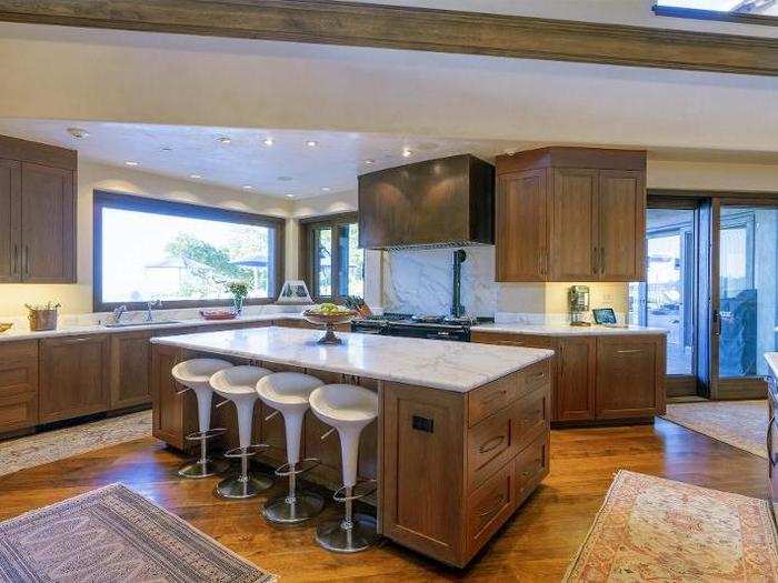 Like the rest of the house, the kitchen is lit with natural light streaming in through large windows.