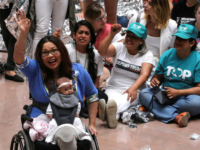 Sen. Tammy Duckworth of Illinois joined in to show her support with her two month-old daughter Maile in tow.