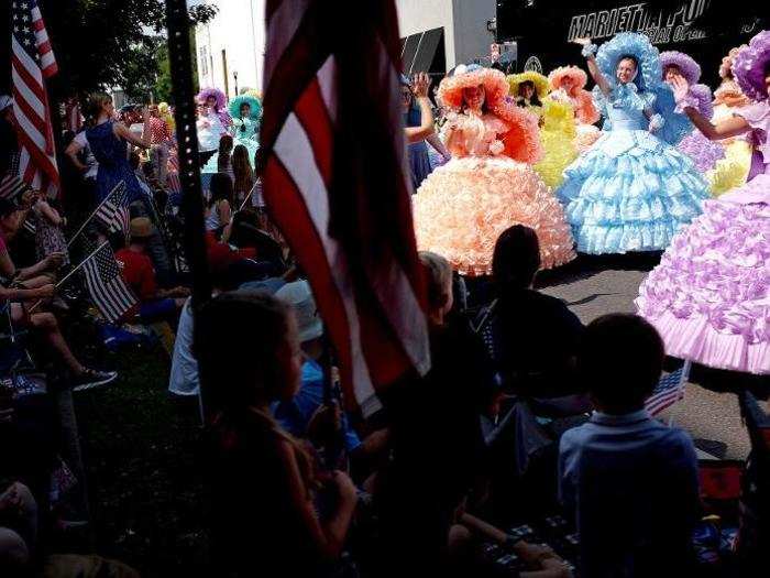 Down in Georgia, southern belles wore their signature antebellum dresses as they made their way down the parade route.