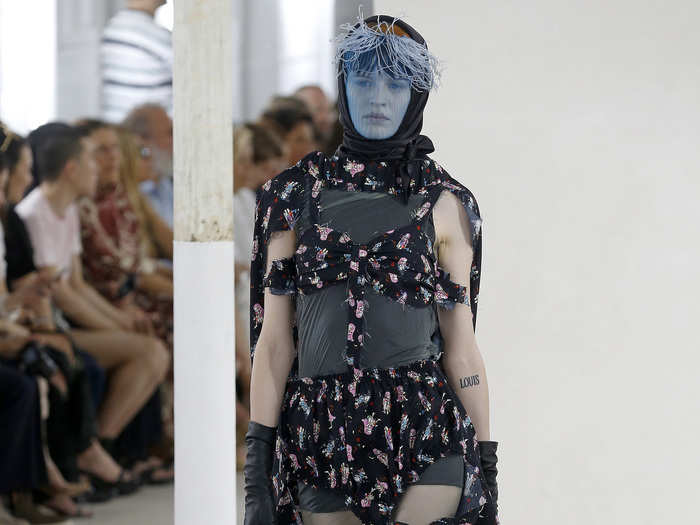 Margiela designed the holsters in various colors, like purple, blue, and orange.