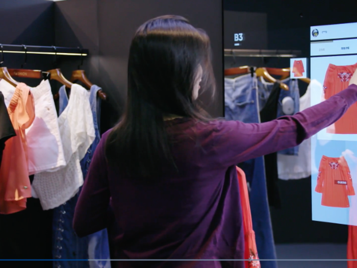 When you pick an item off of the rack, an RFID rack tells the adjacent mirror what you