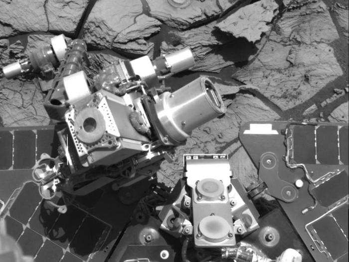 The instruments on the Opportunity rover include cameras, spectrometers that study chemicals and minerals, a rock grinder, and a brush for sweeping dust off rocks.