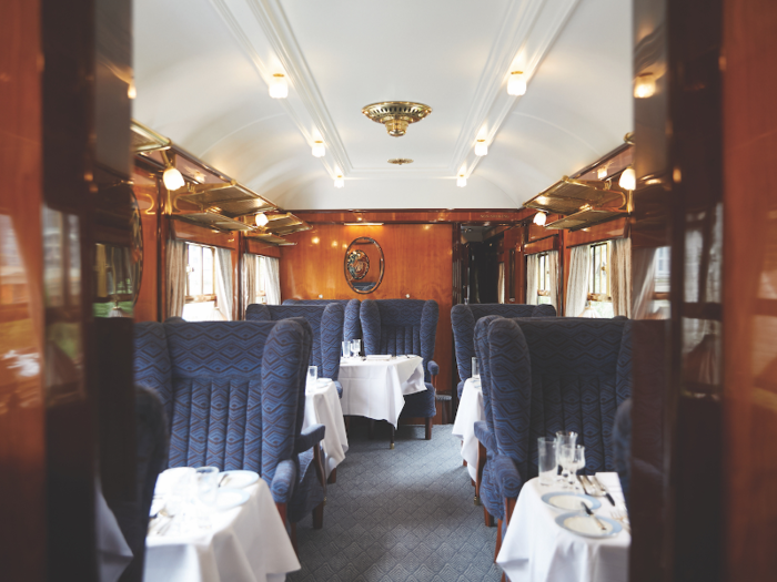 Instead of cramped plastic seating, each carriage is fitted with about 15-20 plush armchairs and linen-covered tables.