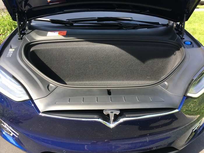 With no internal combustion engines to be found, the front of the Model X is free to serve as a trunk or in this case, a frunk.