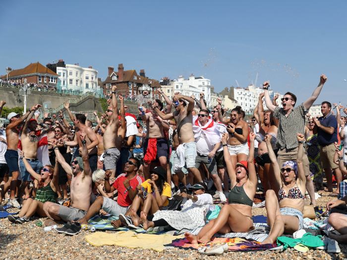 In Brighton, a seaside resort town on the south coast, fans took to the beach in their swimwear to watch the game at the Luna Beach Cinema...