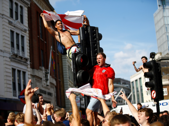 England fans love to climb on things. From traffic lights...