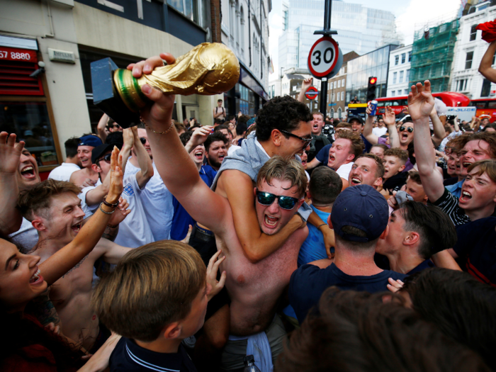 Fans have already started celebrating with replica copies of the World Cup trophy.