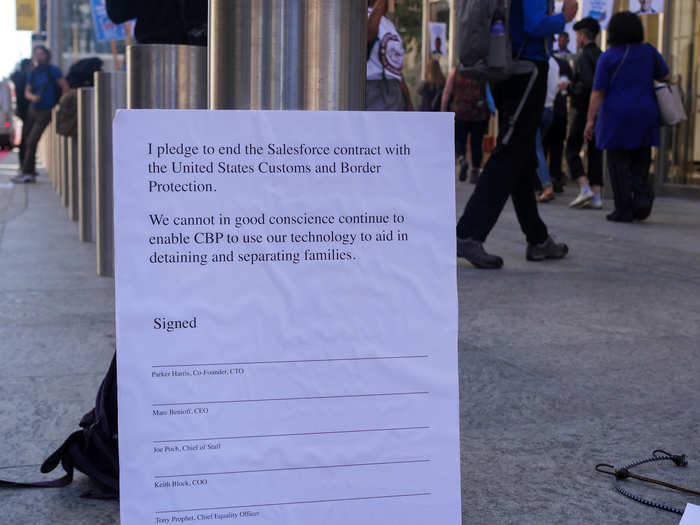 The protestors drafted a pledge for Salesforce execs to sign ending the CBP contract. They took turns listing off the names and yelling "Shame! Shame!" after each one.