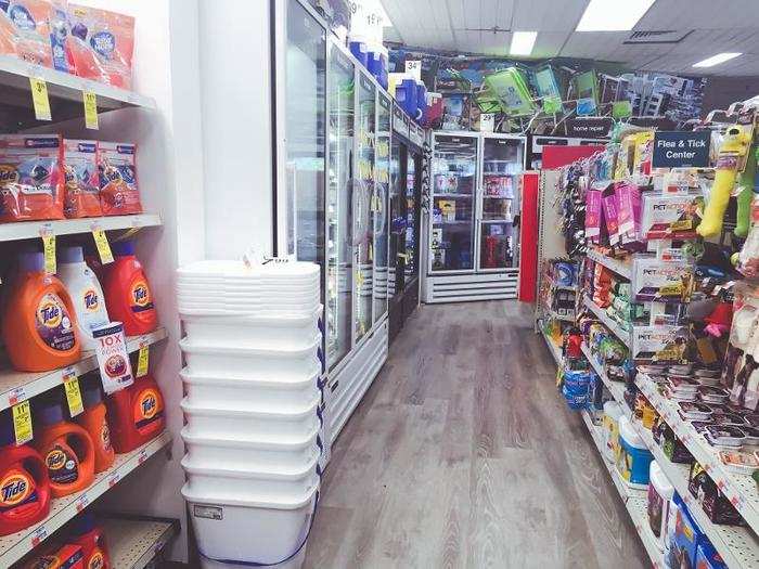 ... and beach chairs sat atop the refrigerators. Cleaning supplies, pet food, sodas, and home-repair tools were all squeezed into one corner of the store. All in all, it felt pretty disorganized.