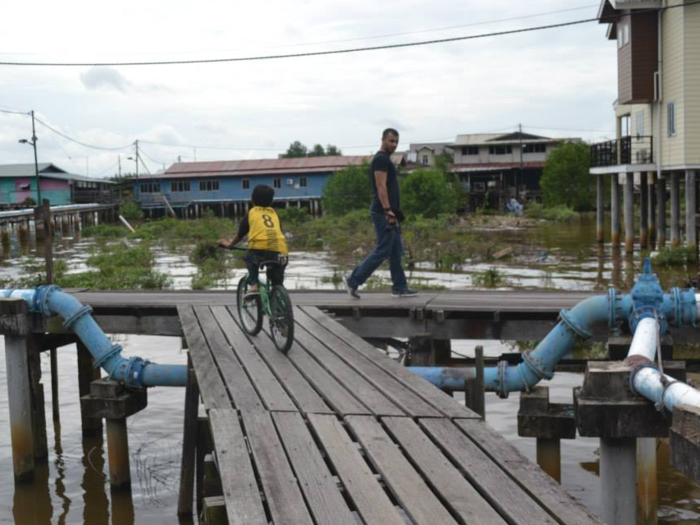 People get around — very carefully — on a series of interconnected walkways.