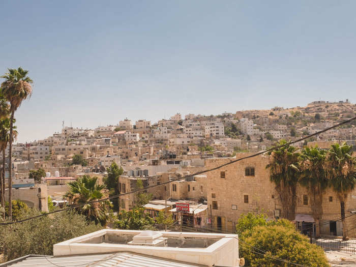 Most of the surrounding suburbs of Hebron are dominated by Palestinians. But one of the biggest suburbs is the Kiryat Arba settlement, which houses nearly 8,000 Israeli settlers. The settlers are known for being a mix of immigrants seeking cheap housing and right-wing extremists.