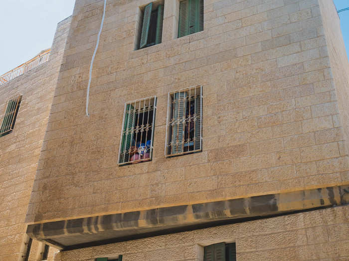 The biggest settlement in Hebron is called Avraham Avinu. Located in the heart of the Old City, many of the buildings look out on the Palestinian market. McLean said he is skeptical settlers throw trash as frequently as the Palestinian shopkeepers claim, suggesting the owners leave the trash there for tourists. Meanwhile, he said that settlers are terrified of terror attacks. After a teenage girl was stabbed in her bed in Kiryat Arba in 2016, settlers have put iron bars on their windows.