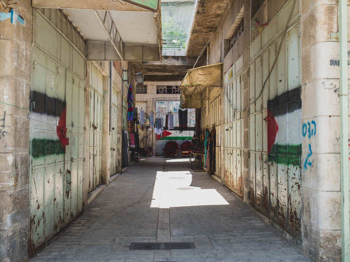 One of the most difficult parts of living in Hebron, according to Al-Mohtaseb, is the constant dealings with soldiers. Palestinians in Hebron are subject to both Israeli military law and Palestinian civil law. But military law says that if a complaint is filed against a Palestinian person, they are treated as guilty until proven innocent, according to Al-Mohtaseb, who has been arrested once and detained countless times. Most of the time, the complaints are filed by Israeli settlers.