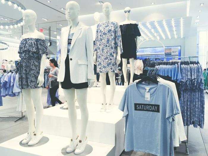 The fluorescent lights and huge windows created a bright and airy atmosphere to shop in. Sundresses, blazers, and t-shirts were displayed in the front of the store.