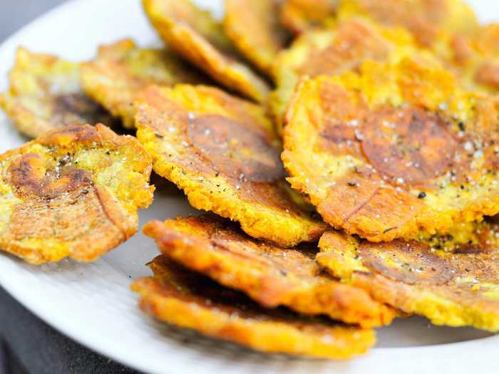 Tostones are smashed and double-fried plantains eaten throughout the Caribbean.