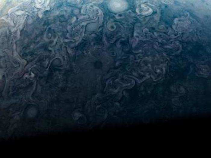 Juno was the first spacecraft to fly above and below Jupiter, photograph the planet