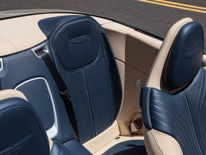 The Aston also has exquisite, brogued leather seats, plus a back seat, plus ...