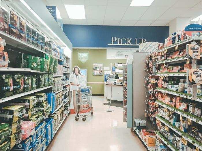 At the end of a long aisle was a pharmacy offering flu shots, blood-pressure tests, and other services. There were multiple aisles of cold medicines and supplements, as well as a small waiting area near the pharmacy, so customers weren