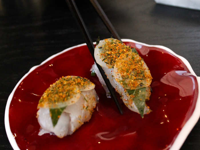 Following the Grains was raw sea bream garnished with Japanese pickled turnip and cherry leaves, placed on a striking red platter. We ate them, and everything else in the meal, using the provided chopsticks.