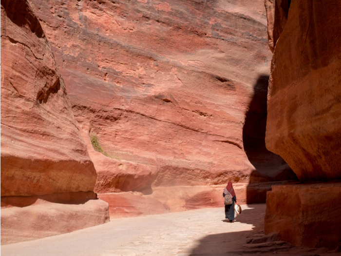 On the way back, the Siq was calm and practically empty. I wished that I was staying the night in Petra so I could leisurely walk up the path and admire the rich striations carved by thousands of years of water passing through the valley.