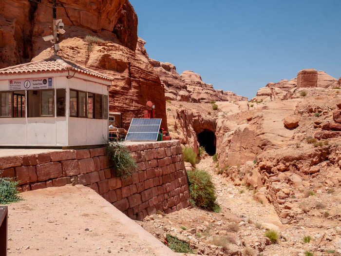 As we reached the bottom of a sloping path, Alhasani stopped the group. He explained that decades ago, tourists used to get hurt by flash floods when it rained at Petra. As the Jordanian government searched for a solution, excavators found this 300-foot tunnel cut into the rock. Built by the Nabataeans, the tunnel diverts flash flood water to two large cisterns that supplied water to the city.