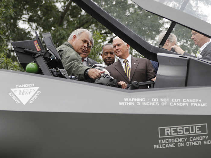 Pence listens to an F-35 test pilot.