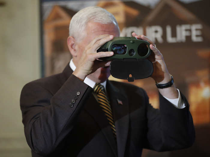 Vice President Mike Pence looks through binoculars manufactured by Oregon-based FLIR Systems.