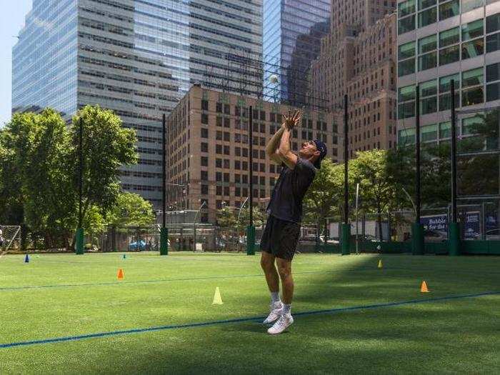 Here, a Goldman employee practices his catching skills. Former major league ball players Dwight Gooden, Mickey Rivers, and John Flaherty also made an appearance.