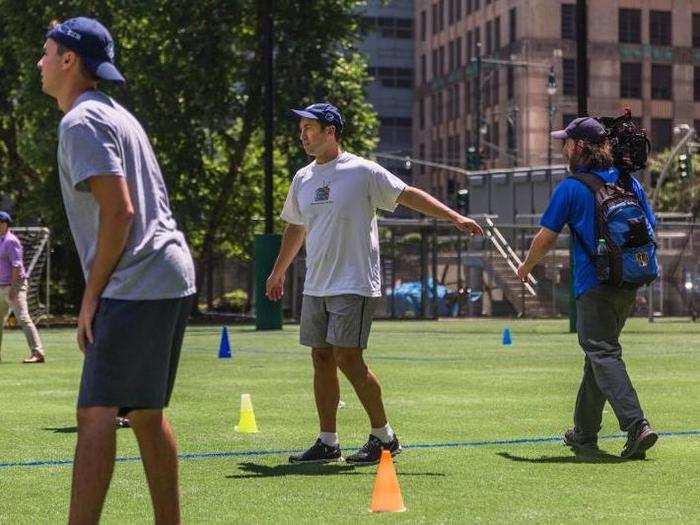 Goldman Sachs partner Brian Levine, seen here in the middle, organizes the event each year. He