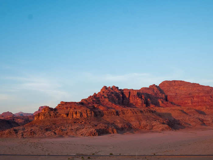 In the hour after sunrise, the desert lights up in crimson. It