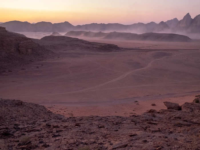 As sunset began to descend, winds picked up the fine sand that blankets the desert. The desert turned to an ethereal purple-red. It looked like one of the sandstorms that Matt Damon