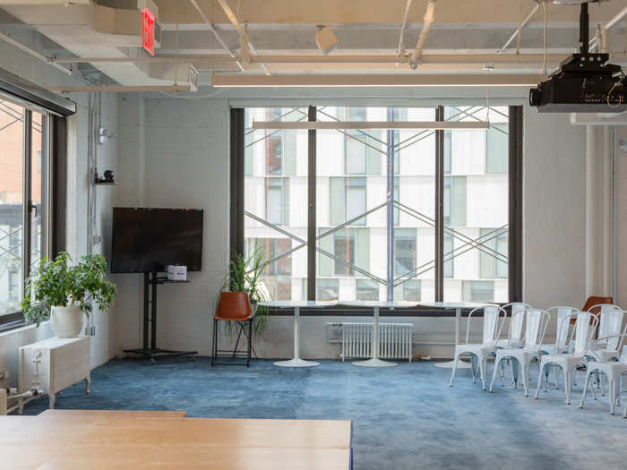 To make sure everyone can see the presenter, Flatiron built out a stage at the front of the space.