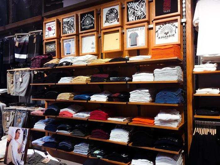 There was a big wall of graphic tees with different variations of the Vans logo.