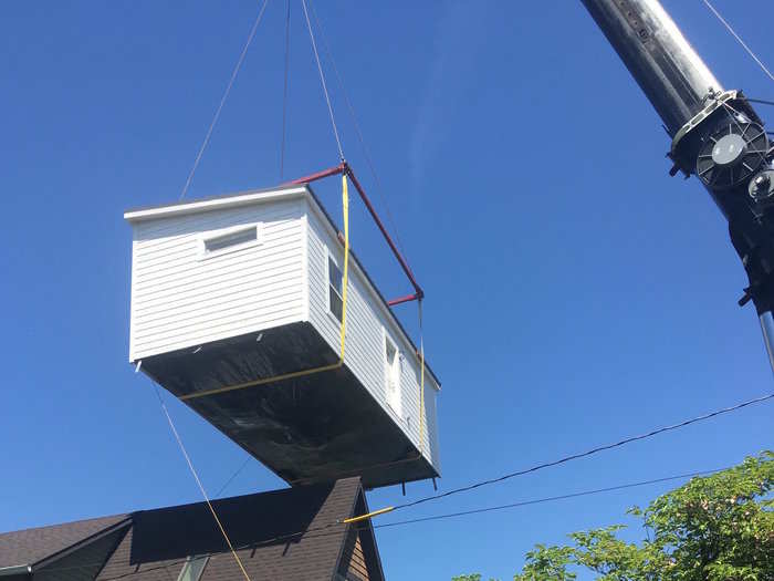 Once completed, the home is installed on-site via crane.