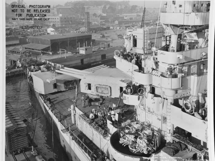 The ship was armed with nine eight-inch guns (two of which are seen below in the bow), four five-inch guns, twenty-four 40mm intermediate range guns and thirty-two 20mm guns.