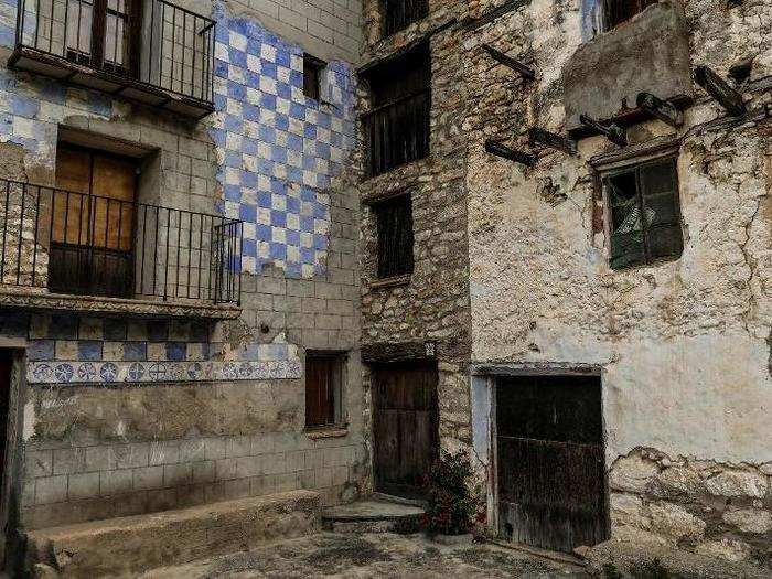 Nearly all of the homes in the village are abandoned, and "For Sale" signs still hang on some of them.