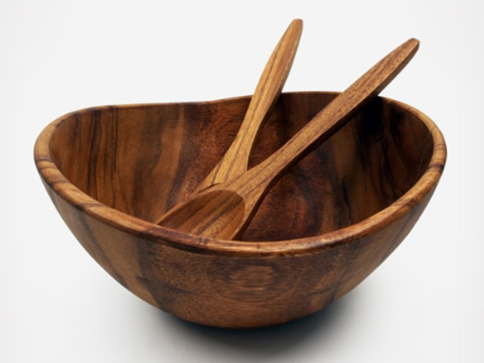 A stylish serving bowl and matching tongs