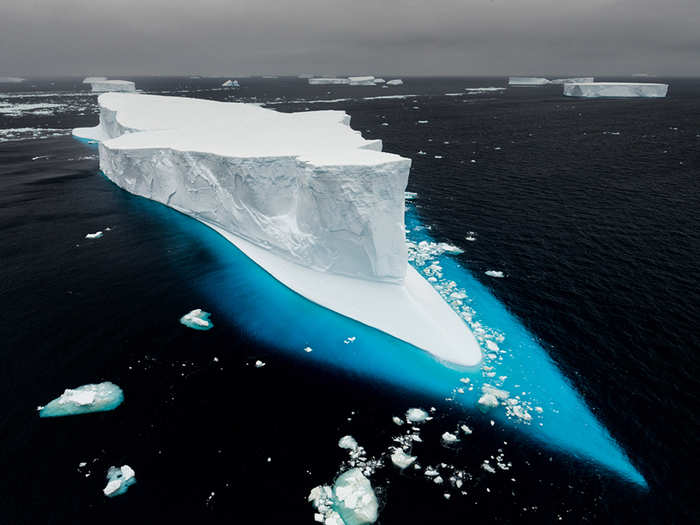 An iceberg cruises like a ship through the Antarctic sound.