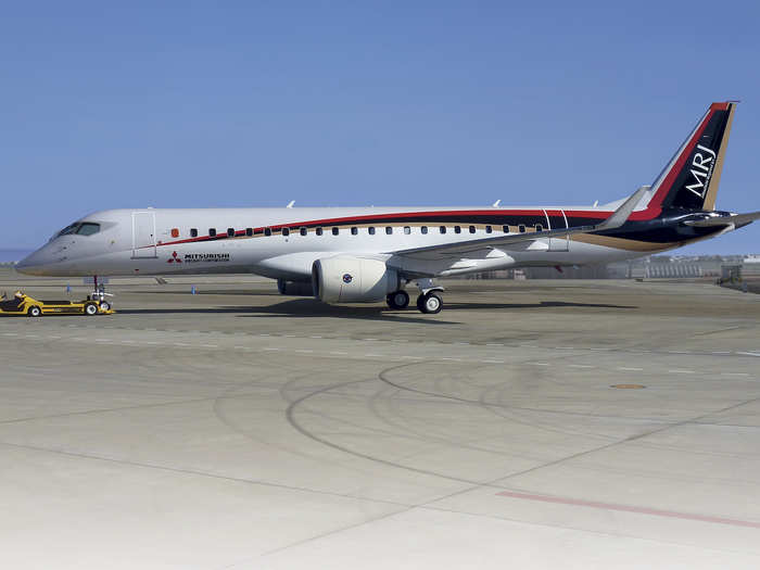 Since the show plane is hidden behind barricades, heres an unobstructed view of an MRJ test plane.