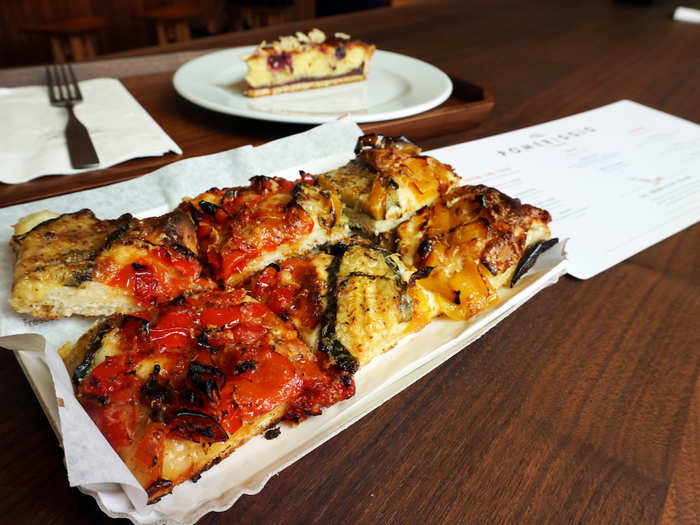 Food is the focus, and focaccia pizza is a popular option. This verdure grigliate (grilled vegetable) pizza cost $8 a slice.