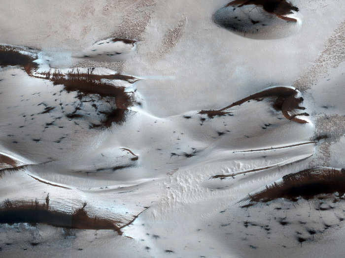 In January of 2014, Orbiter photographed these sand dunes far to the north as they emerged from their winter carbon-dioxide dry-ice cover.