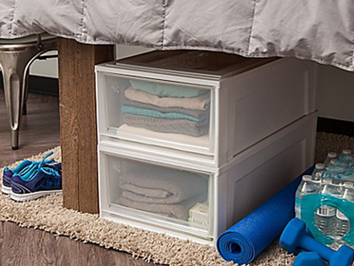 A set of plastic drawers for easy underbed storage