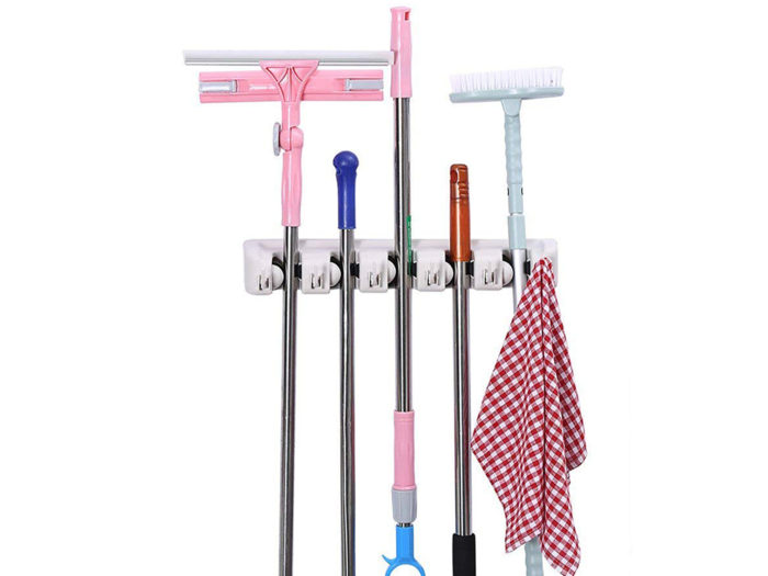 A mop and broom holder that keeps your useful tools accessible