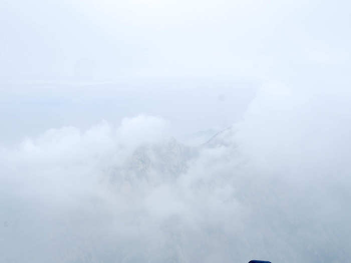 But I was glad I had all that safety equipment. When I looked behind me, there was nothing but clouds. In the distance I could see a lower peak.