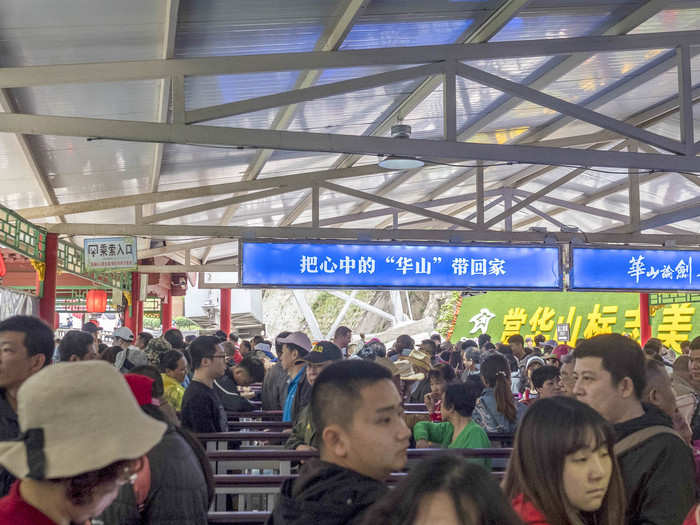 Another hour later and I was only this far. There were piles of instant noodle cups and empty plastic bottles at the end of each aisle. Everyone was seemingly killing time by snacking.