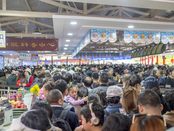 Once I got through the pagoda — another 30 minutes — the line opened up into this nightmare. There were food vendors on either side selling snacks. I realized that I had made a horrible mistake trying to take the cable car. I was going to spend the entire day in line.