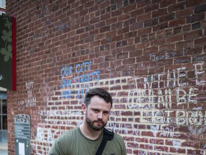 Andrew Little, an audio-visual technician who worked in downtown Charlottesville, came to the site to leave a message for Heyer. One year ago, Little had been trying to drive out of downtown Charlottesville with his brother when they were stopped at an intersection by a large crowd of counter protestors filling the street.