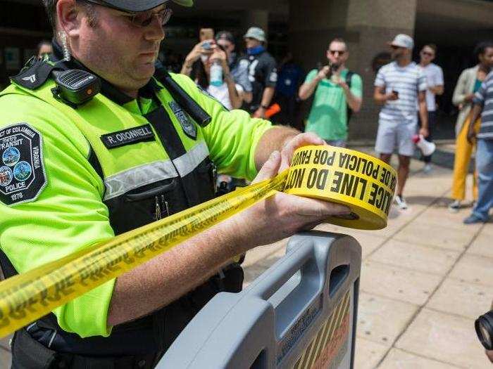 Press and counter-protesters waited outside of the Foggy Bottom Metro Station for the white supremacists to arrive for their planned march to Lafayette Park.