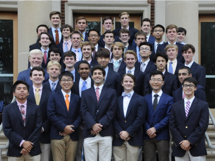 Students must follow a strict dress code: a navy blazer, khaki pants, brown or black dress shoes, and a "tasteful necktie." Students also must be clean-shaven and maintain  a neat, short haircut.