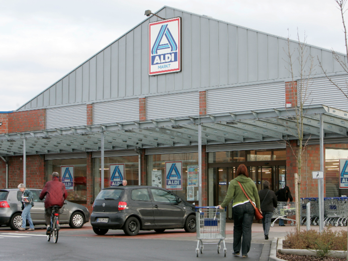 The two stores still operate separately. Aldi Nord has a simpler, white-and-blue logo, and Aldi Sud has the blue-and-orange logo we recognize in the US.